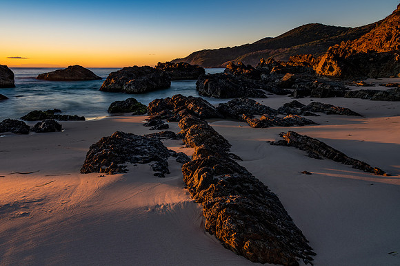 Sunrise seascape and a rocky beach