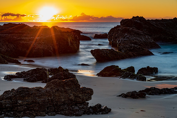 Sunrise seascape and a rocky beach