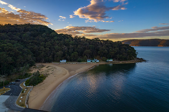 Peaceful sunrise over the bay with boats