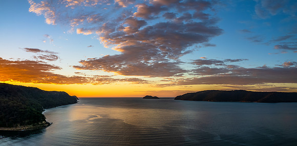Peaceful sunrise panorama over the bay
