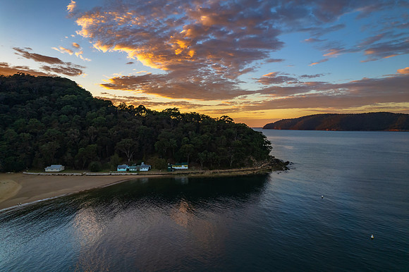 Peaceful sunrise over the bay with boats