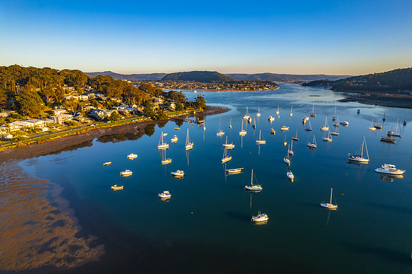 Early morning aerial waterscape with boats