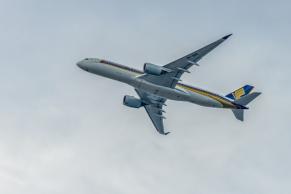 Airplane flying up amongst the clouds