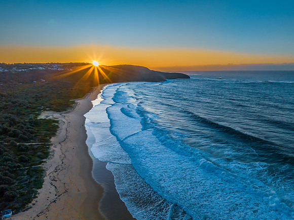 Sunrise and waves at the seaside