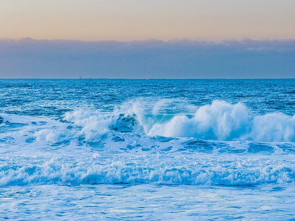 Sunrise and waves at the seaside