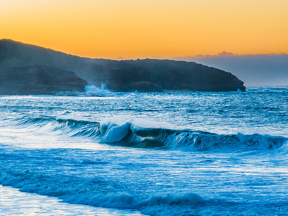 Sunrise and waves at the seaside