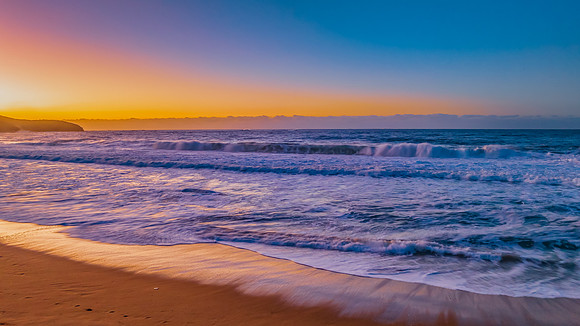 Sunrise and waves at the seaside