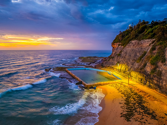 Pretty Sunrise at the seaside with rain clouds