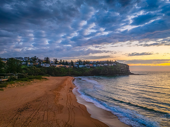 Pretty Sunrise at the seaside with rain clouds