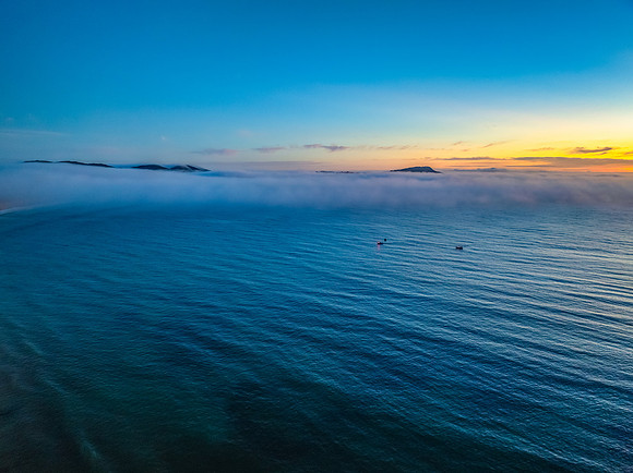 Foggy sunrise at the seaside
