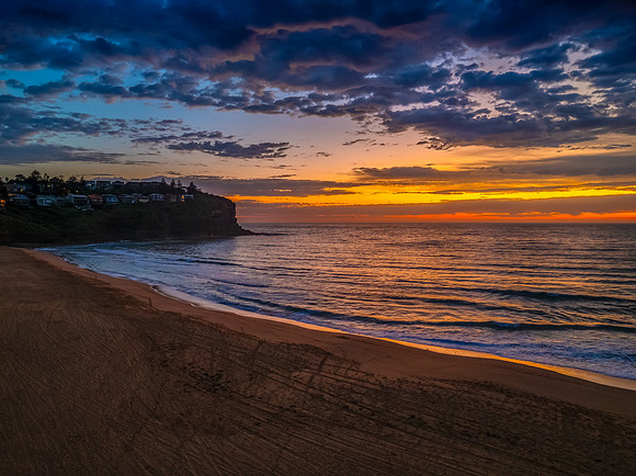 Pretty Sunrise at the seaside with rain clouds