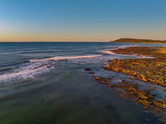 Aerial sunrise seascape with  clear skies