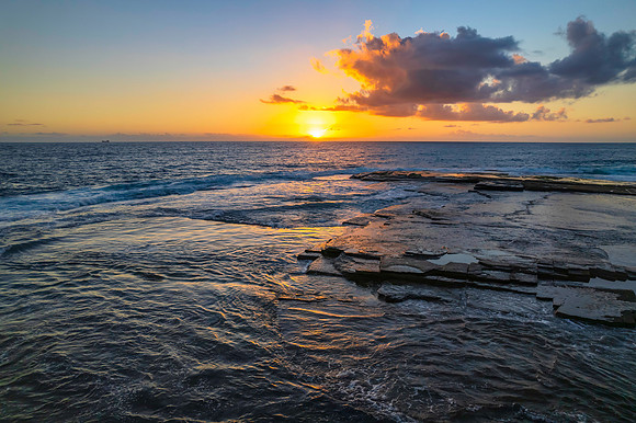 Aerial Sunrise Seascape at Rocky Inlet with clouds