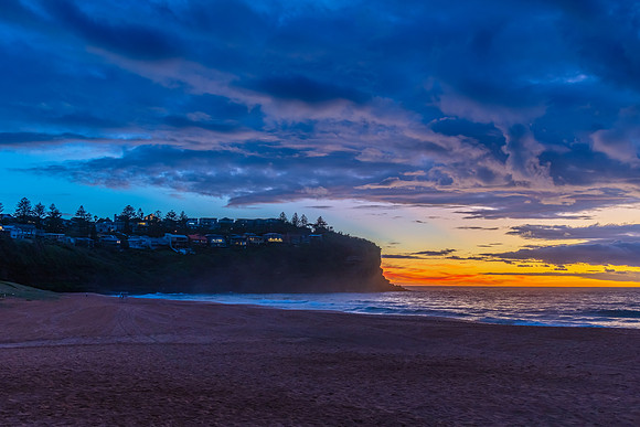 Sunrise at the Seaside with rain clouds