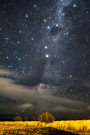 Stargazing at the night sky and milky way with clouds