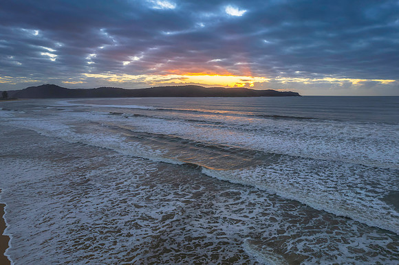 Cloudy aerial sunrise seascape