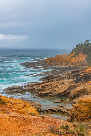 Overcast morning seascape with rocky headland at Bermagui