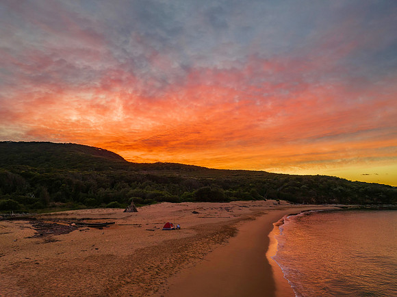 High cloud sunrise over the beach and mountain