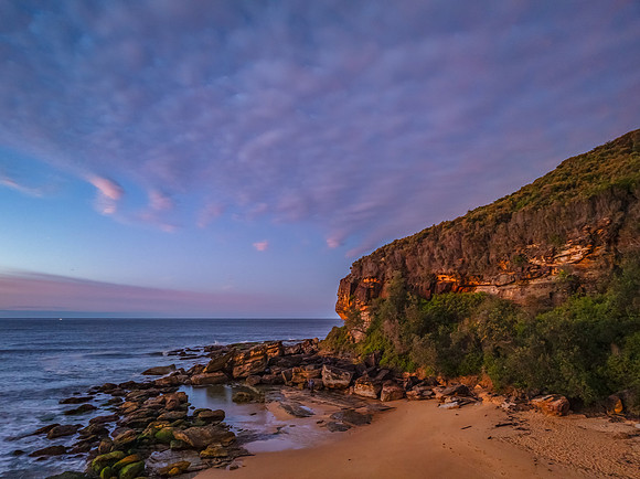 Winter seascape views over the beach with high and medium cloud