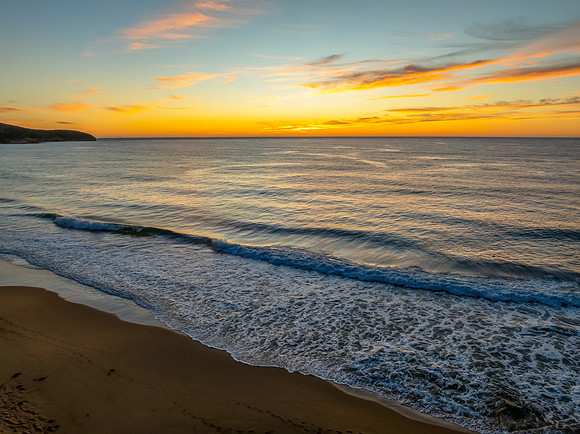 Sunrise at the seaside with high cloud