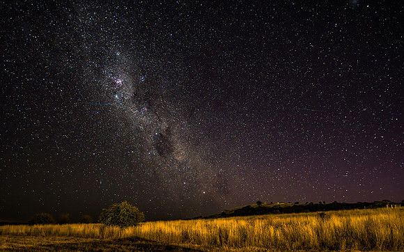The night sky and Milky Way Galaxy with satellites