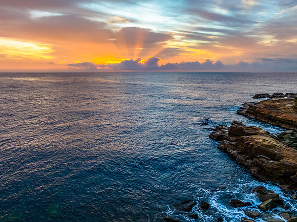 Aerial Sunrise Seascape Shrouded in Fog and High Clouds