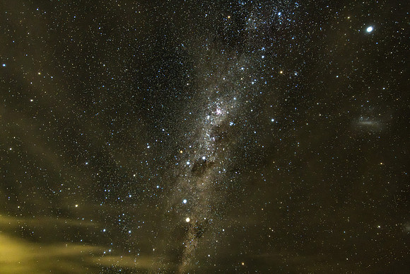 Stargazing at the night sky and milky way with clouds