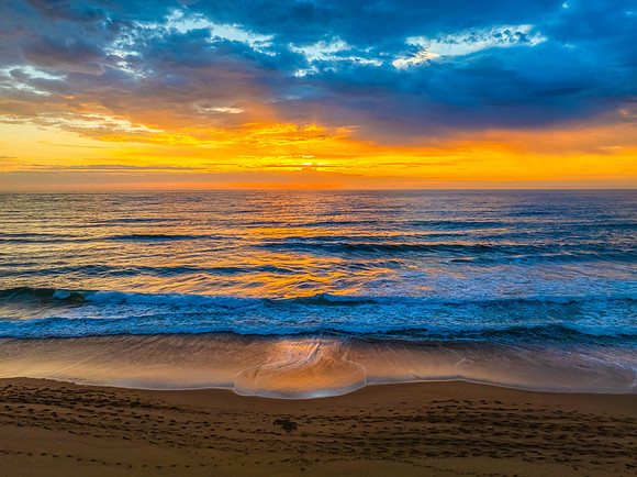 Pretty Sunrise at the seaside with rain clouds