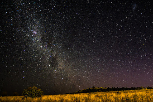 The night sky and Milky Way Galaxy with satellites