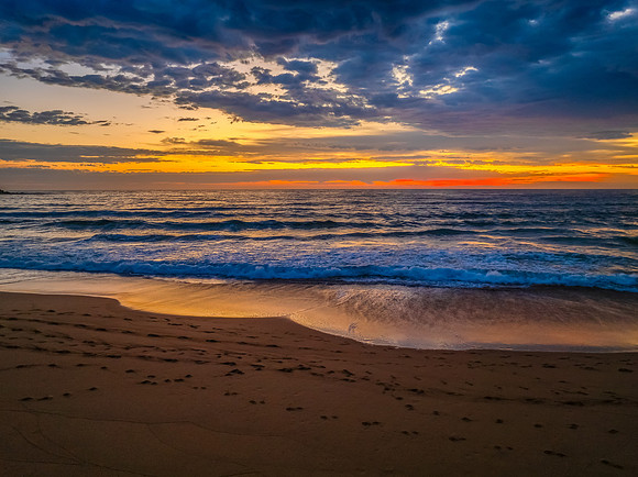 Pretty Sunrise at the seaside with rain clouds