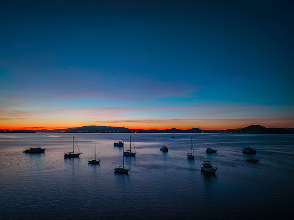 Dawn colours up the bay with high cloud