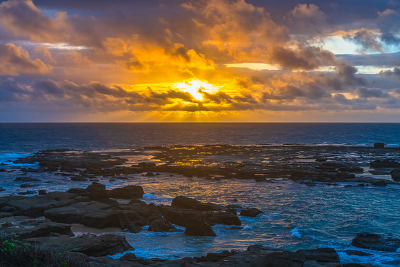 Sunrise seascape with strong southerly winds