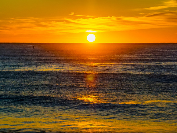 Sunrise at the seaside with high cloud