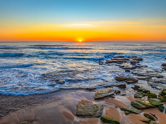 Sunrise at the Seaside with an Orange Horizon