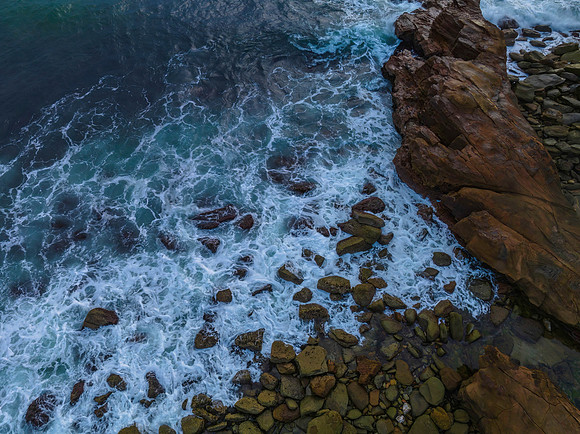 Top down rocks and the sea during sunrise