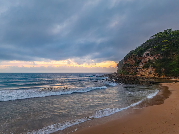 Cloud filled sunrise at the seaside
