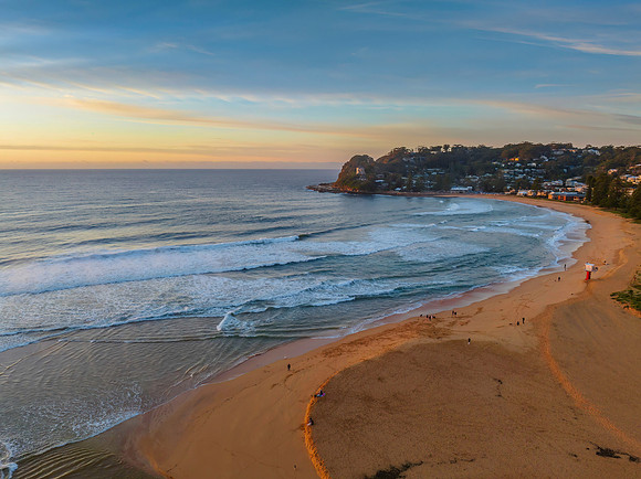 Sunrise and high cloud cover by the sea and lagoon