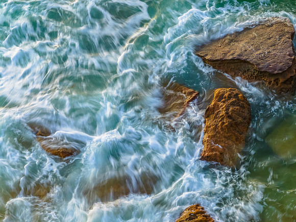Rocks and sea action in the early morning light