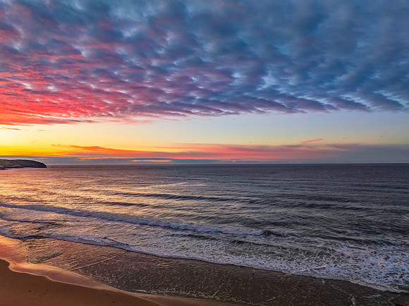 Winter seascape views over the beach with high and medium cloud