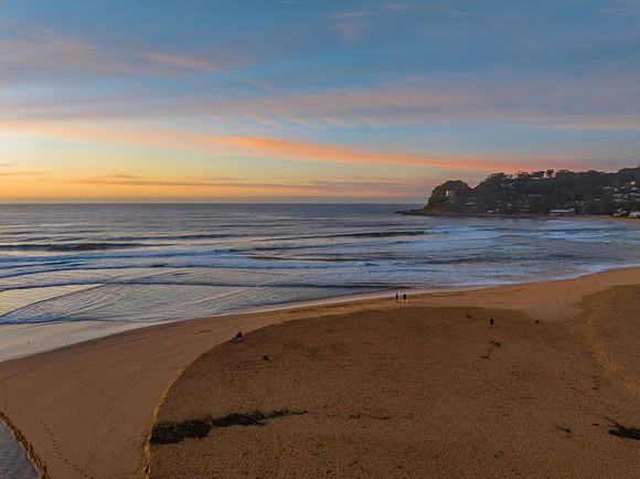 Sunrise and high cloud cover by the sea and lagoon
