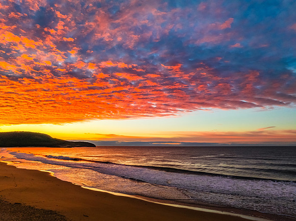 Winter seascape views over the beach with high and medium cloud