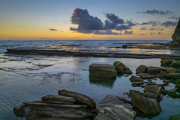 Aerial Sunrise Seascape at Rocky Inlet with clouds