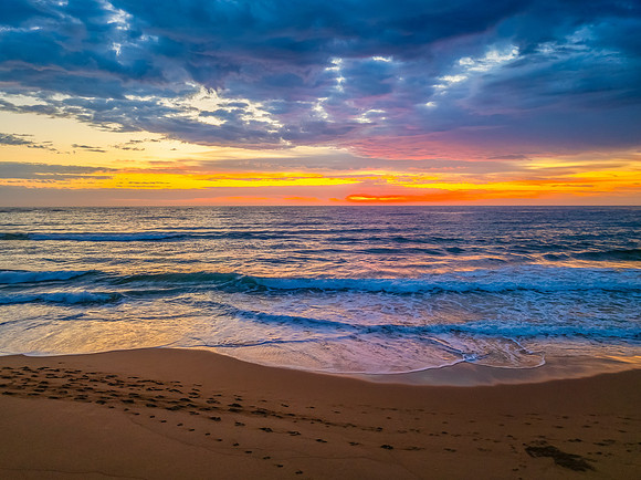 Pretty Sunrise at the seaside with rain clouds