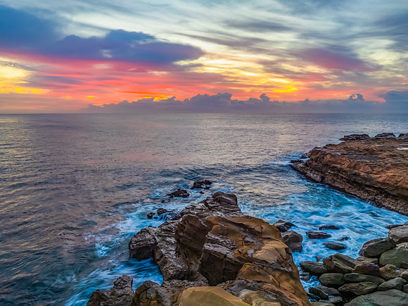 Aerial Sunrise Seascape Shrouded in Fog and High Clouds