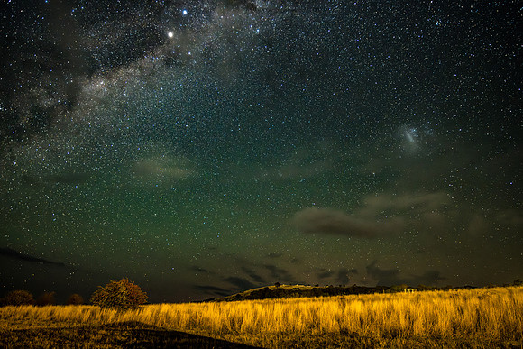 The night sky with some light cloud over the countryside