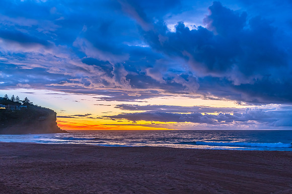 Sunrise at the Seaside with rain clouds