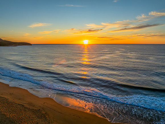 Sunrise at the seaside with high cloud