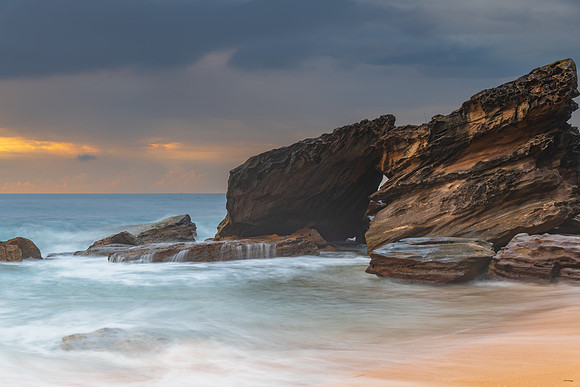 Sunrise at the seaside with rocks and beautiful diffused light b