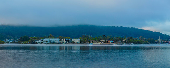 Foggy sunrise panorama waterscape