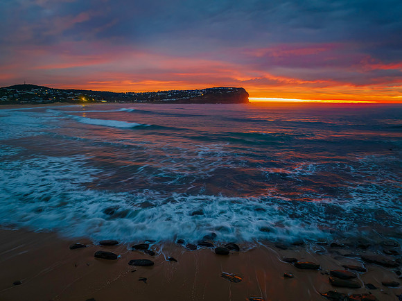 Cloud filled sunrise seascape